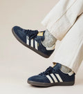 Navy leather casual sneaker with white stripes