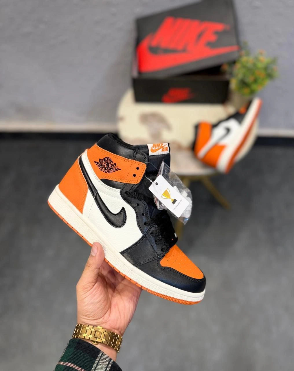 Side profile of Air Jordan Retro 1 Hot Orange sneakers