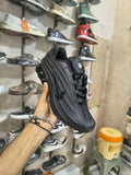 All-black men's sneakers with sculpted sole