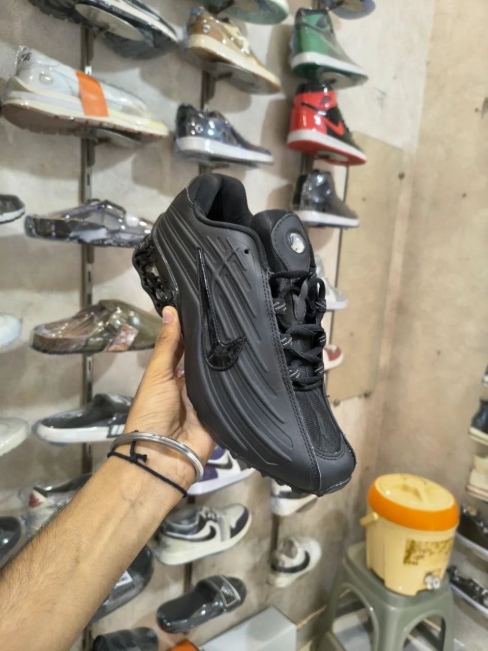 All-black men's sneakers with sculpted sole