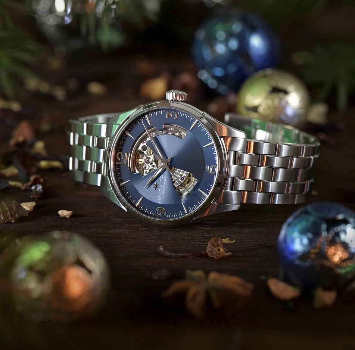 Silver metal case skeleton watch with blue dial
