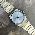 Tissot PRX stainless steel wrist watch close up