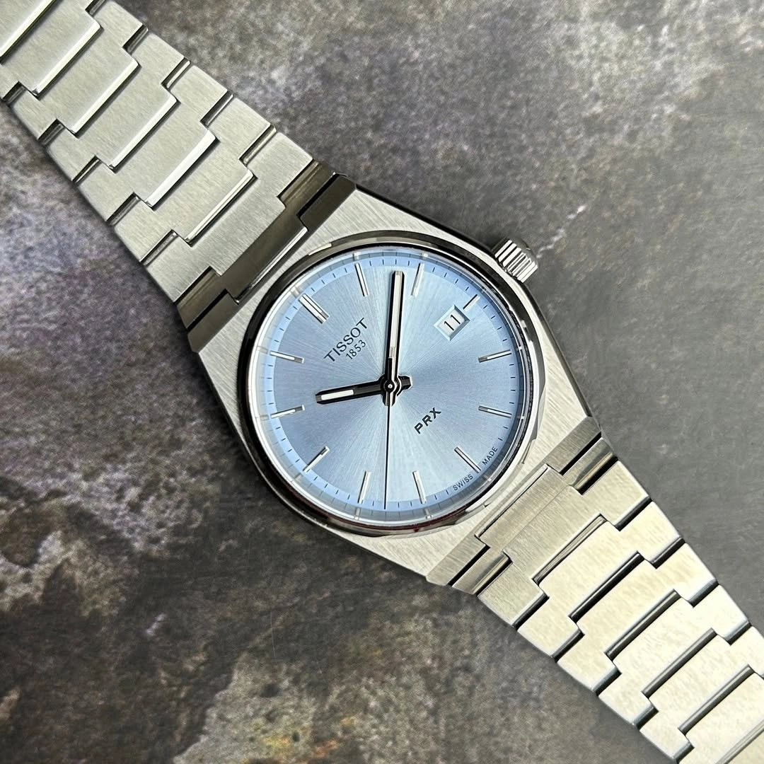 Tissot PRX stainless steel wrist watch close up