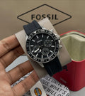 Black Fossil Bannon watch with day and date indicators.
