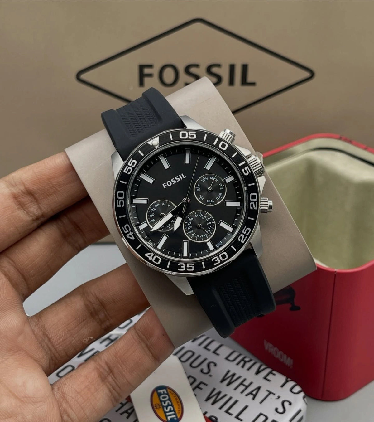 Black Fossil Bannon watch with day and date indicators.