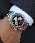 Gold chronograph watch with rainbow bezel
