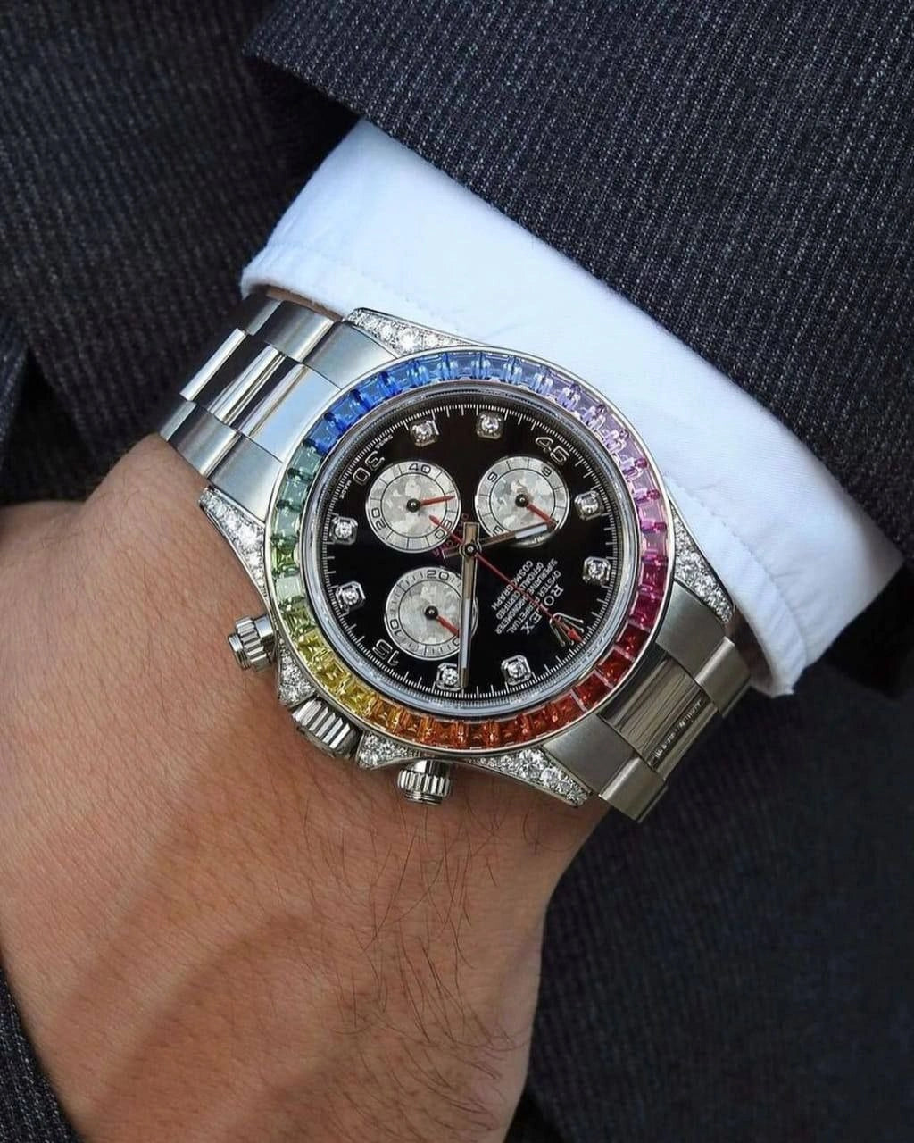 Gold chronograph watch with rainbow bezel
