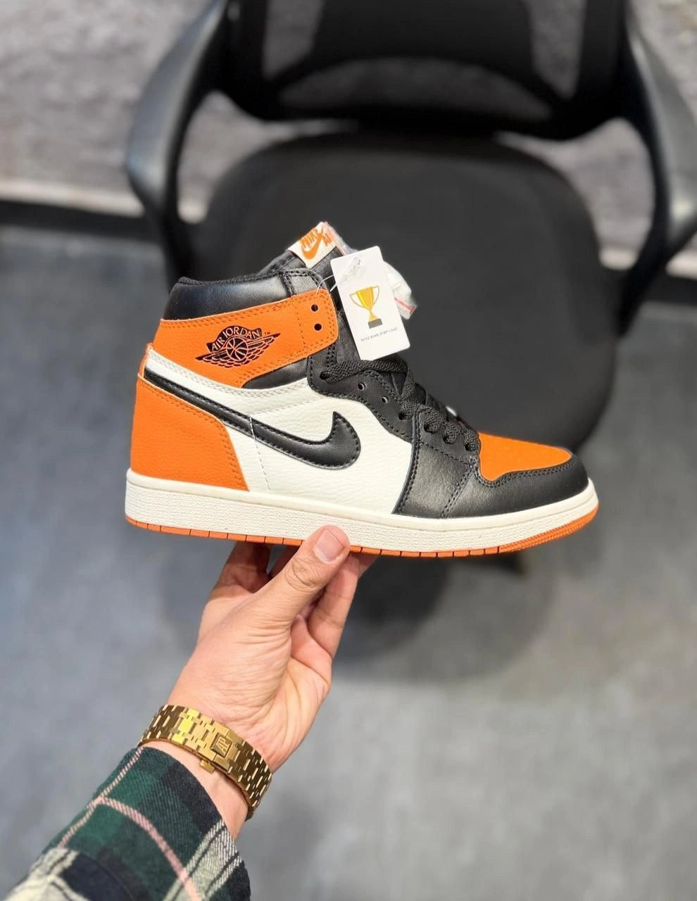High-top streetwear sneakers in orange and black colorway