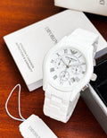 Black luxury wristwatch with Roman numeral markers
