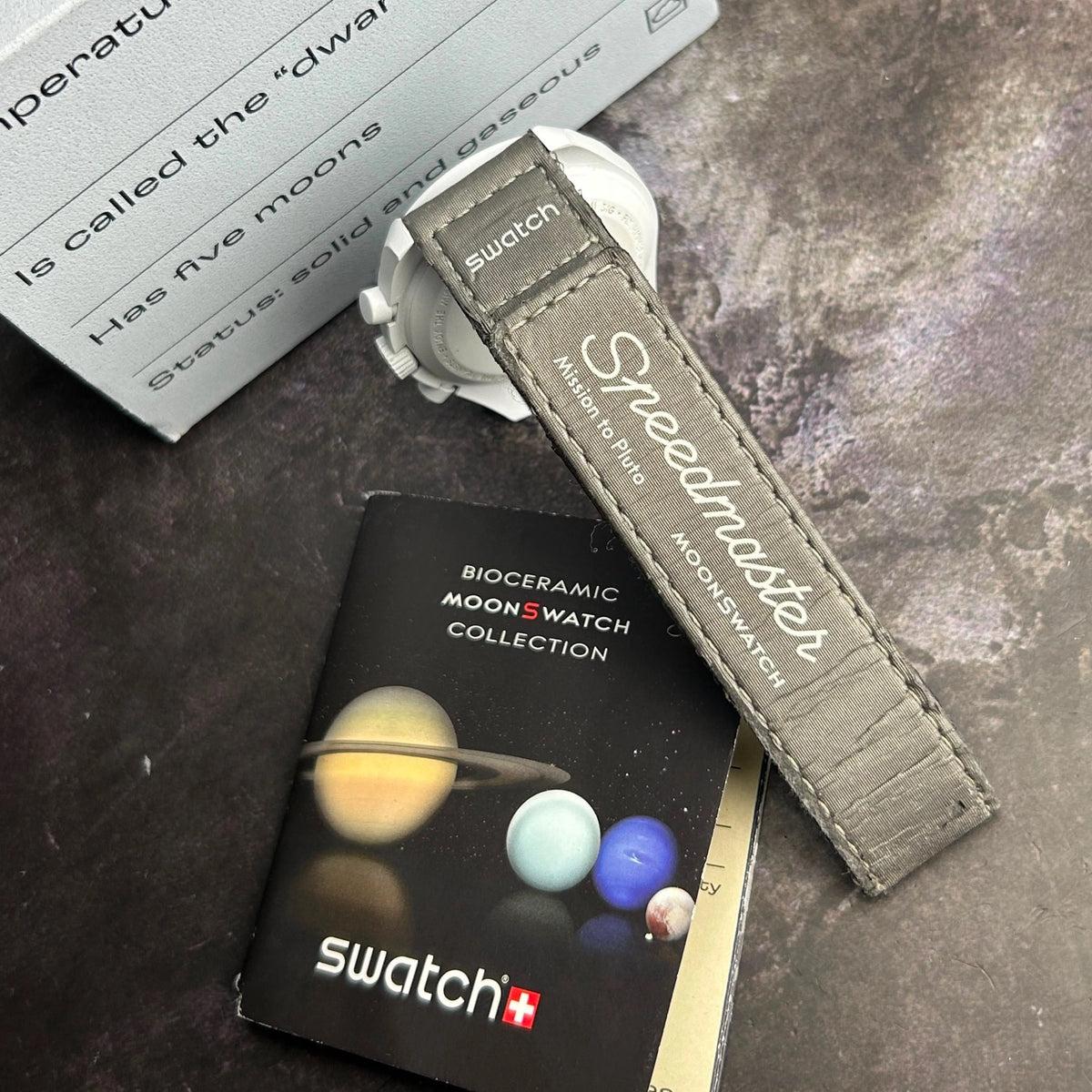 MoonSwatch-inspired watch with detailed analog dial.