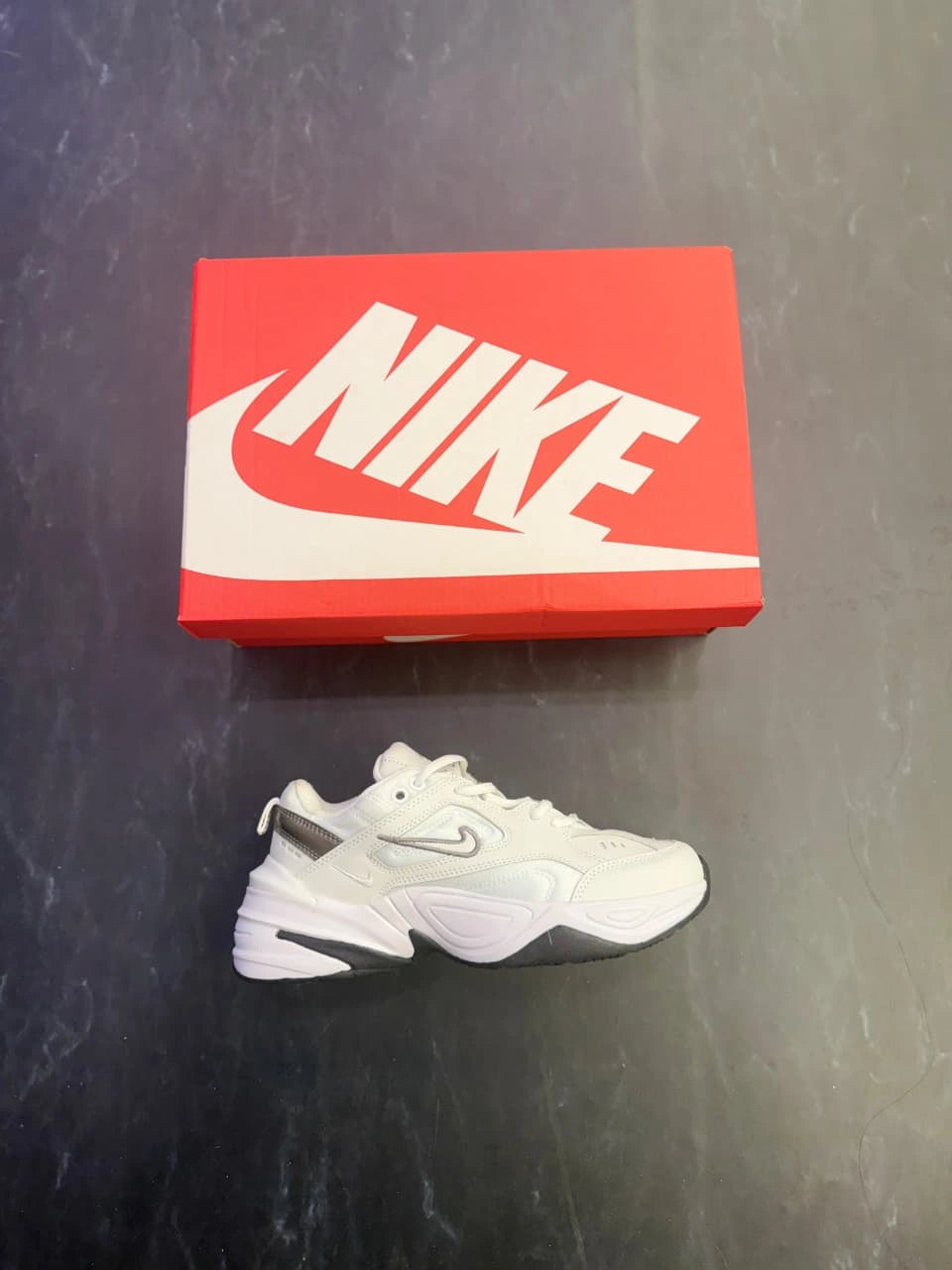 Grey Nike sneakers with soft padding and lightweight feel