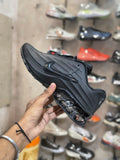 Men's black sneakers with textured panel detailing