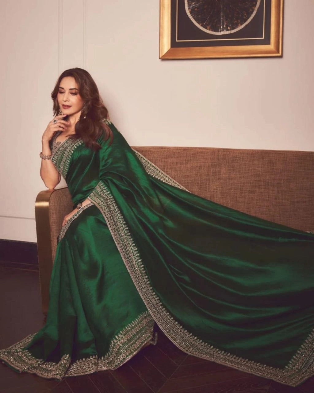 Premium soft satin embroidered saree in emerald green with stitched blouse