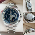 Black dial chronograph watch with date indicator close-up view