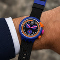 Blue Swatch watch with black dial and chronograph display