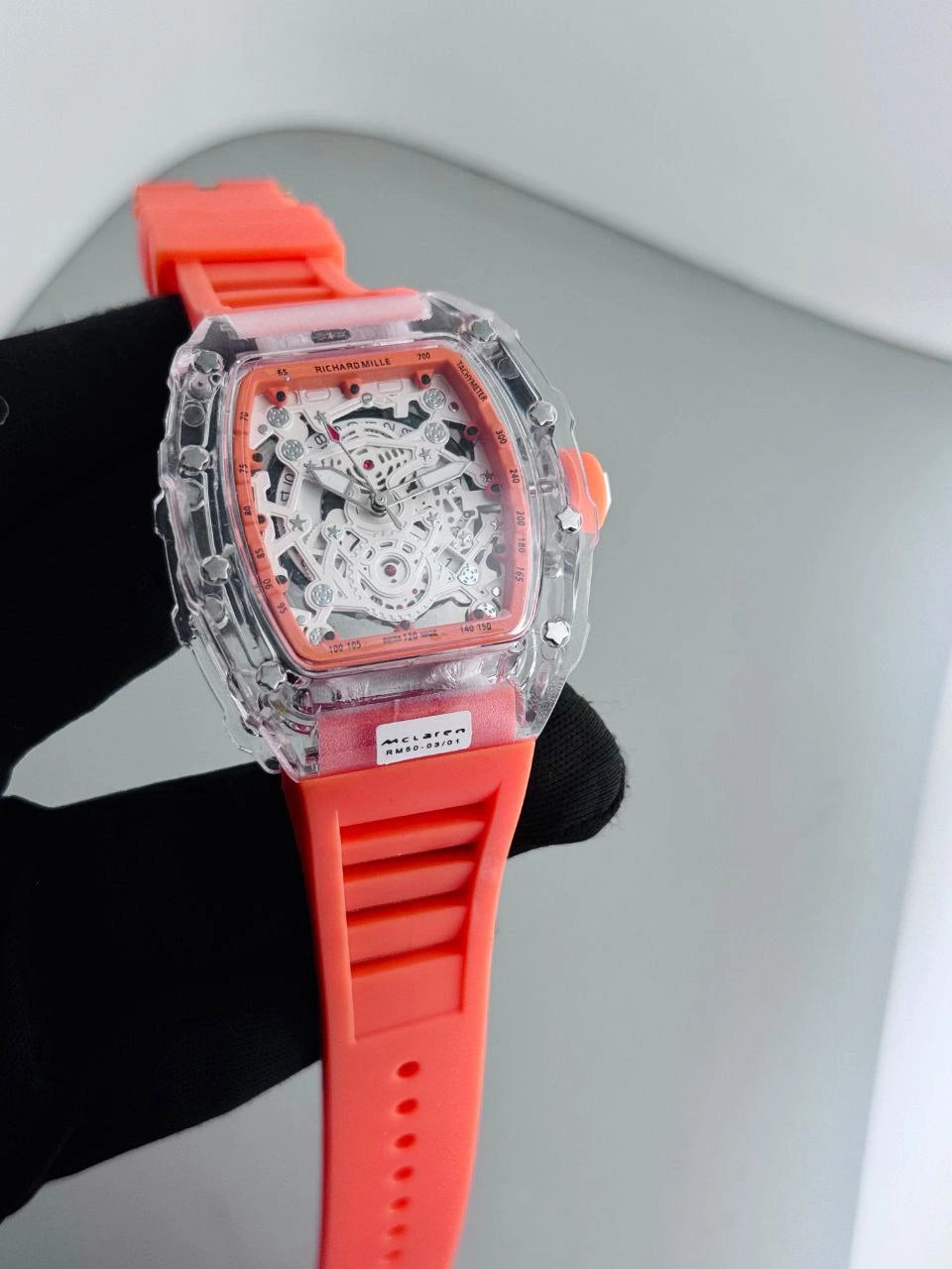 Tonneau dial sports watch with rubber strap