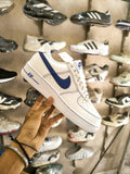 White men's sneakers with blue side detailing
