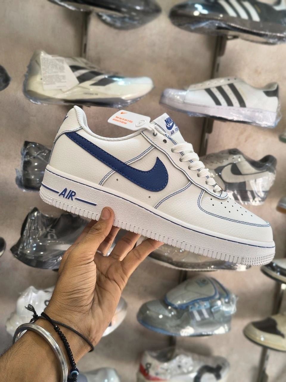 White sneakers with blue accent side design