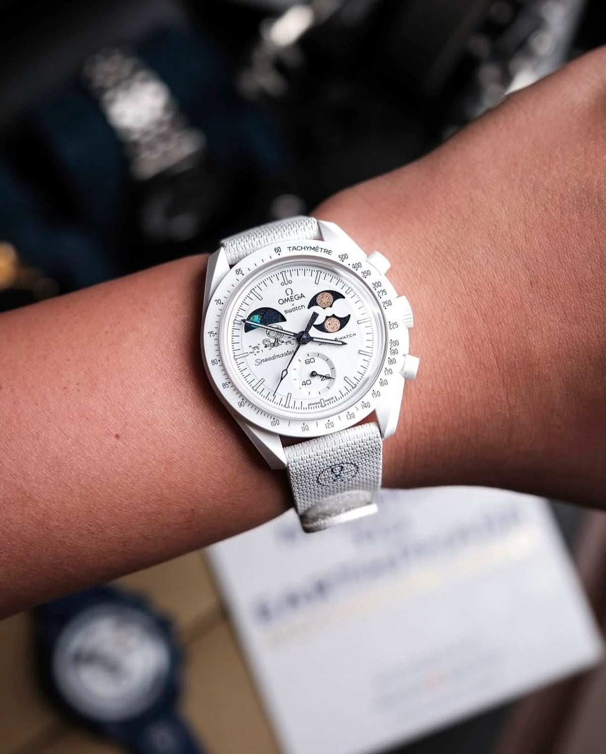 White dial men's chronograph-style wristwatch with black detailing
