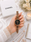Gold-tone women's watch with elegant decorative markers