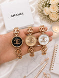Gold bracelet watch with logo-inspired dial design
