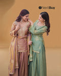 Women wearing green zari embroidered sharara set
